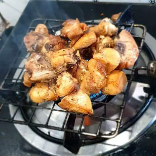fried meat cooked over fire for smoky flavor